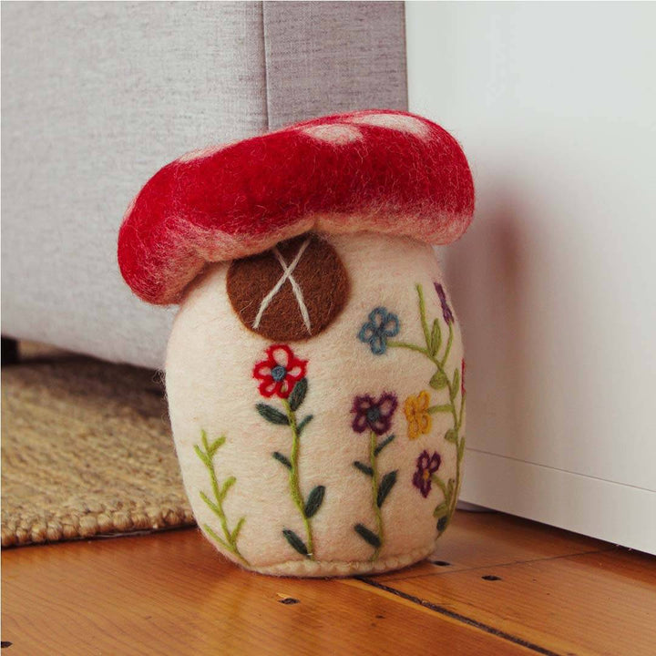 Large Felted Mushroom on a hardwood floor.