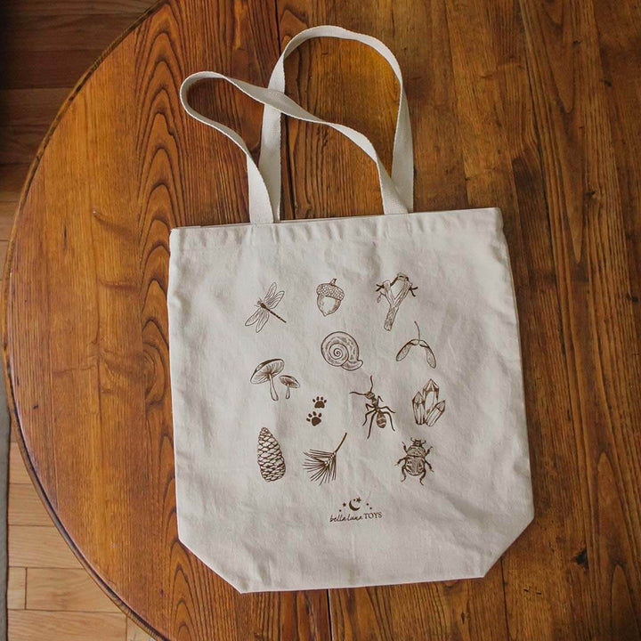 Nature Treasure Hunt Canvas Book Tote on a wooden table.