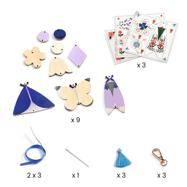 Kit include 3 sticker sheets, 9 wooden butterfly pieces, 3 ribbons, 3 tassles, and 3 keychain clips