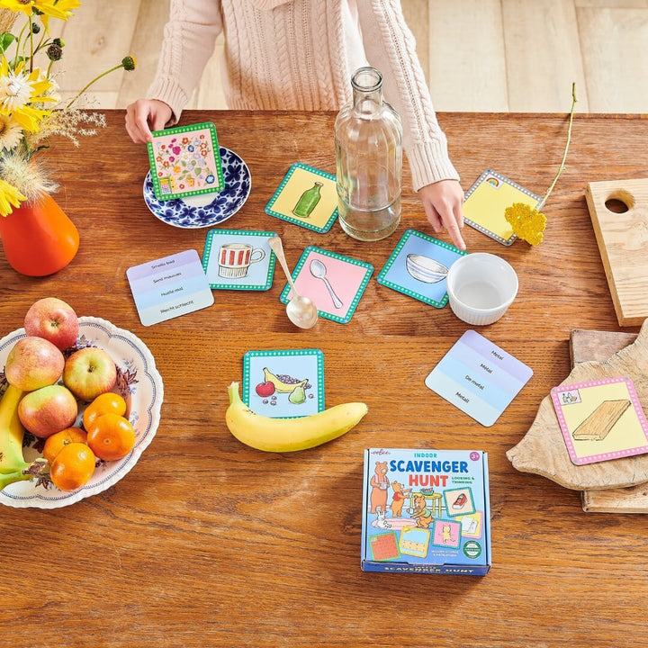 A child points to the items they gathered while playing the Indoor Savenger Hunt game from eeBoo.