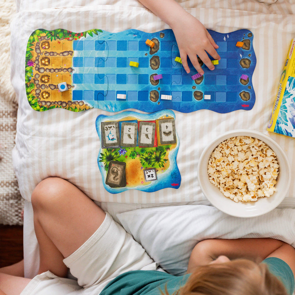 Water Dragons board game from overhead as two kids play the game.