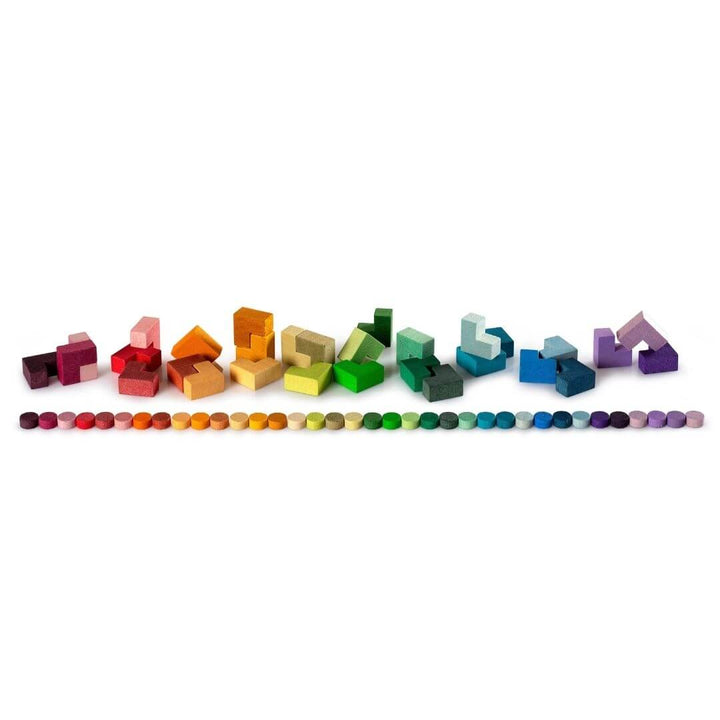 Grapat Bloom Wooden Mosaic Set – L-shapes and dots arranged in a line  in cascading rainbow hues for open-ended play, pattern-making, and creative exploration.