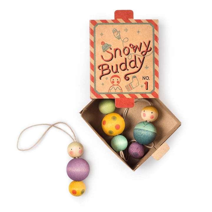 Grapat Snow Buddy Wooden Ornaments in a cardboard box.