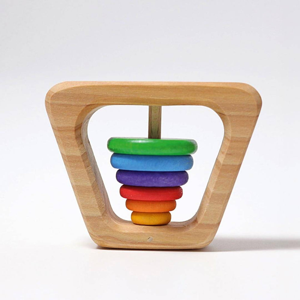 Grimm's Wooden Rainbow Pyramid Rattle - a natural base with green, blue, purple, red, orange, and yellow round discs that comprise the rattle - upside down