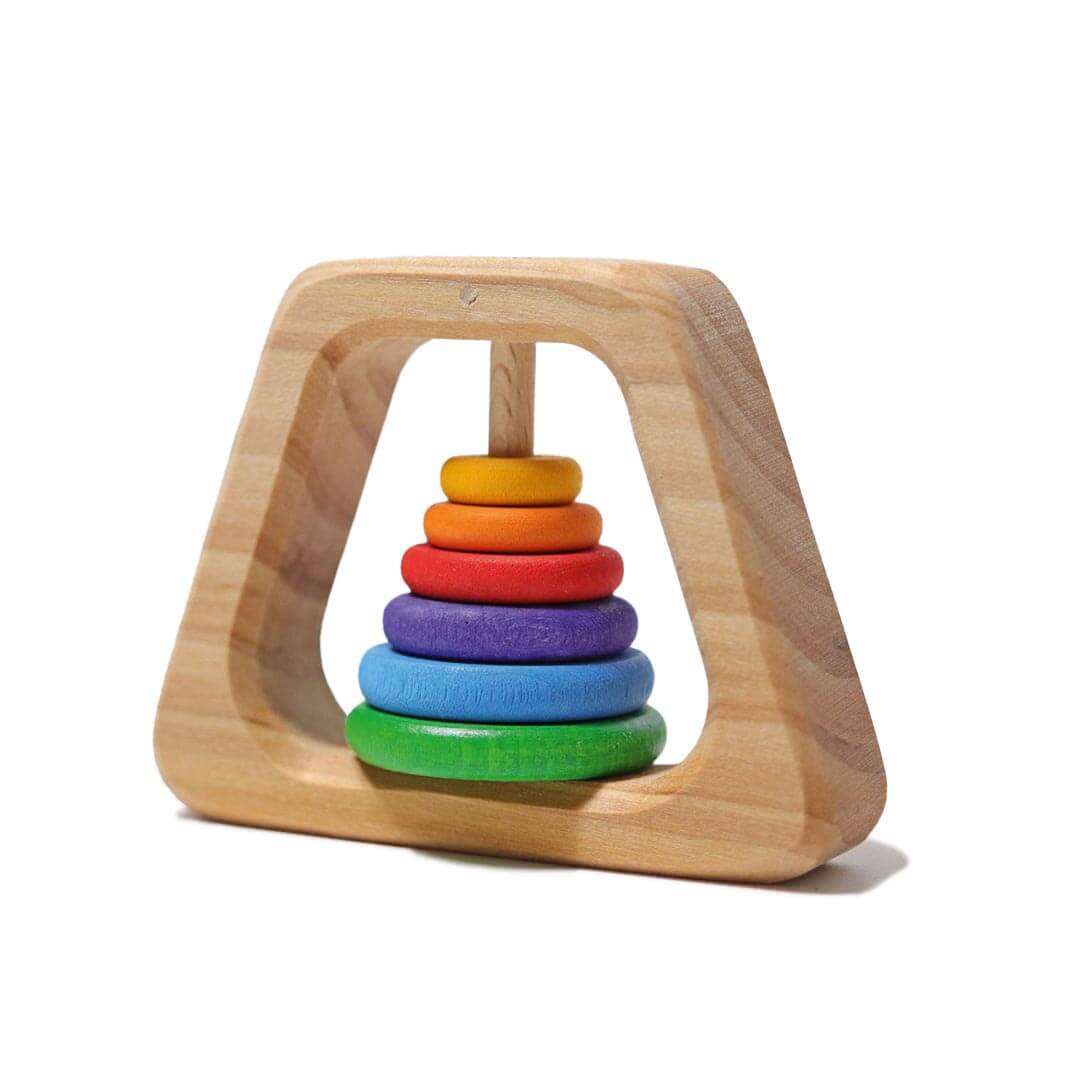 Grimm's Wooden Rainbow Pyramid Rattle - a natural base with green, blue, purple, red, orange, and yellow round discs that comprise the rattle