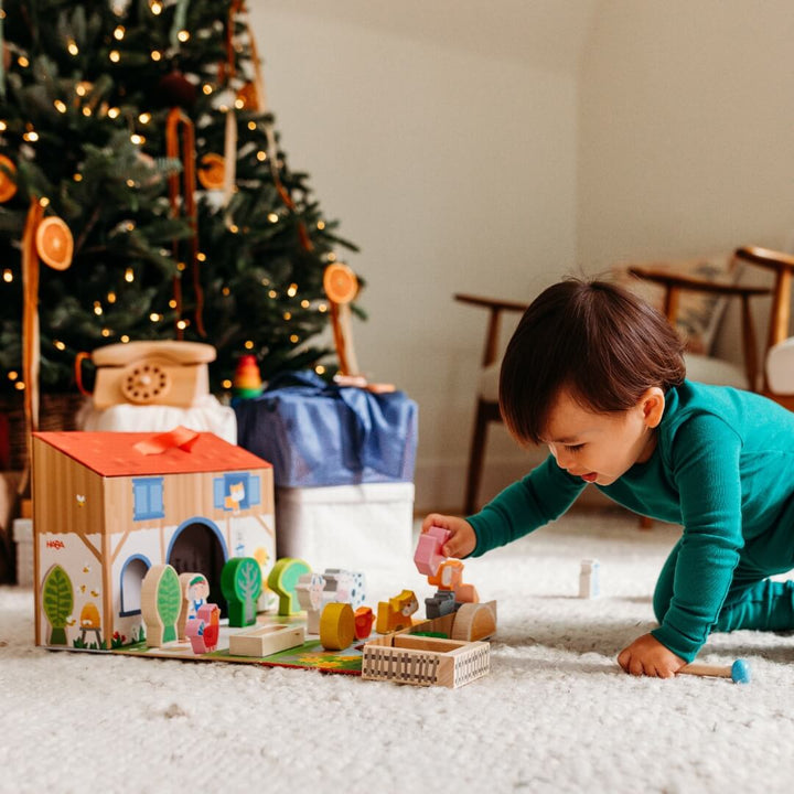 A child playing with HABA's Play World on the Farm