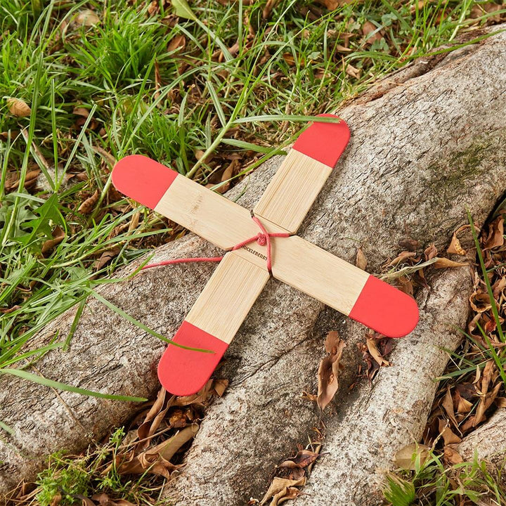 Huckleberry Pocket Boomerang outside on tree stump in the grass