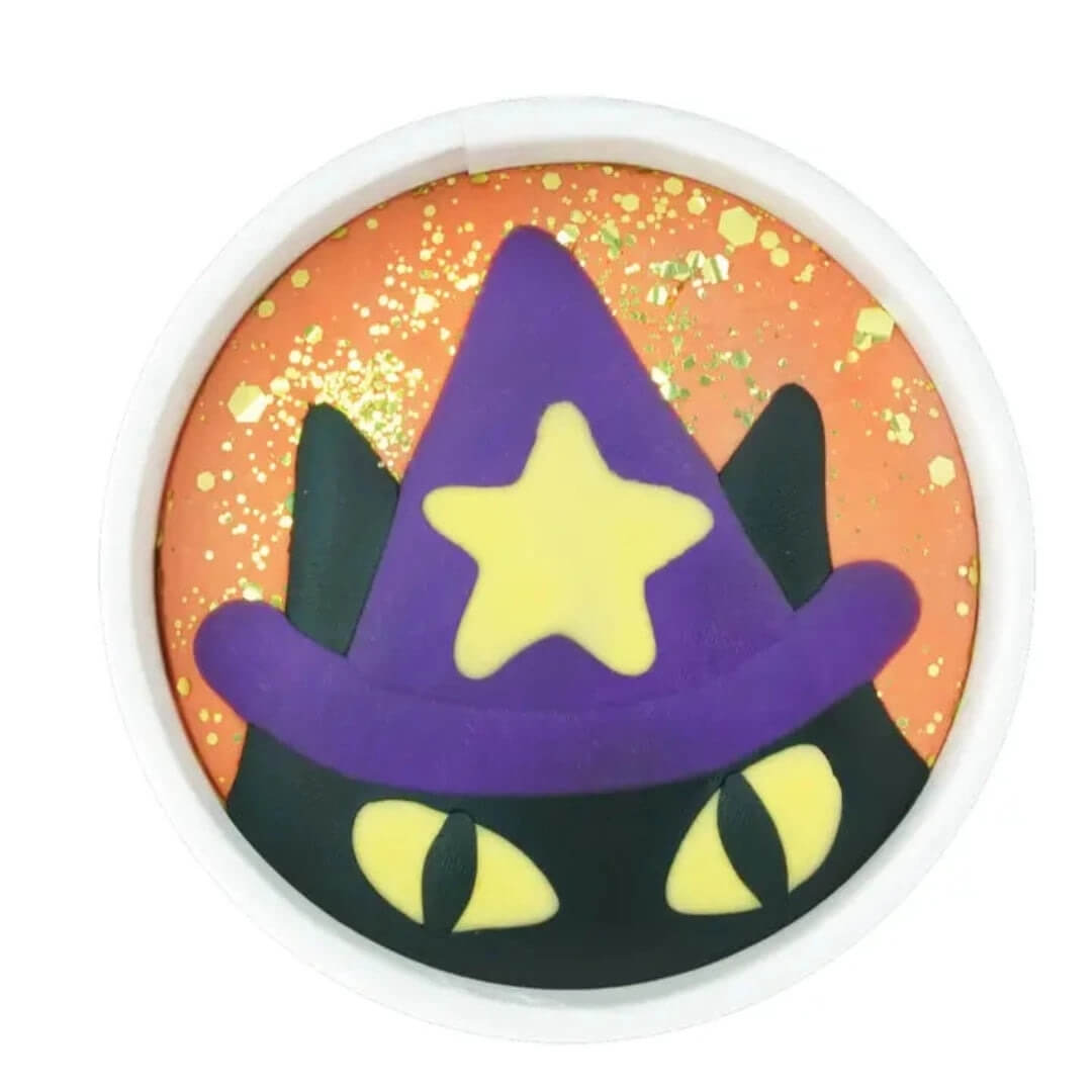 A play dough cup featuring a black cat wearing a purple wizard hat.