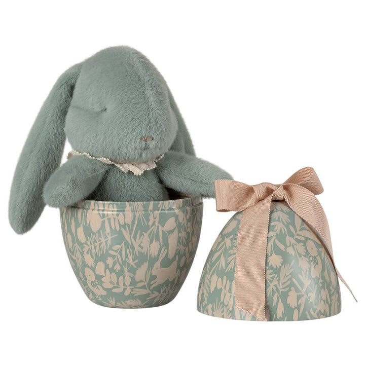 A fluffy mint blue bunny in a metal easter egg tin from Maileg.