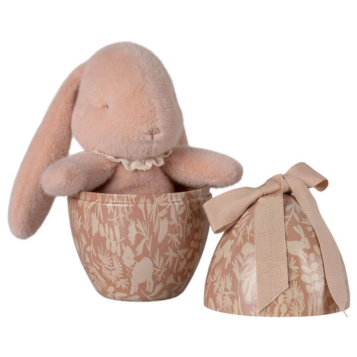 Maileg pink fluffy bunny sitting in a metal easter egg.