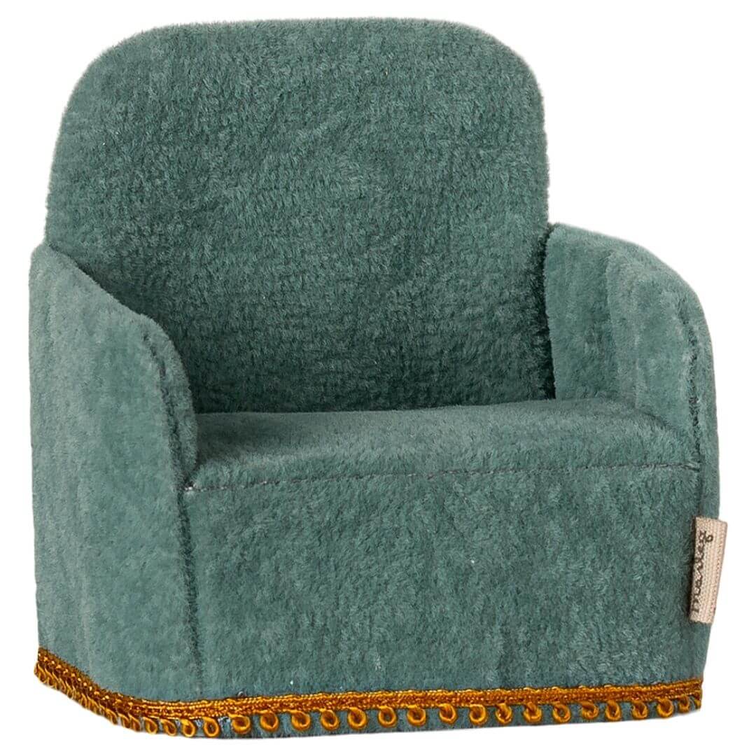 Maileg folding mouse sized arm chair in teal with gold accent on bottom.