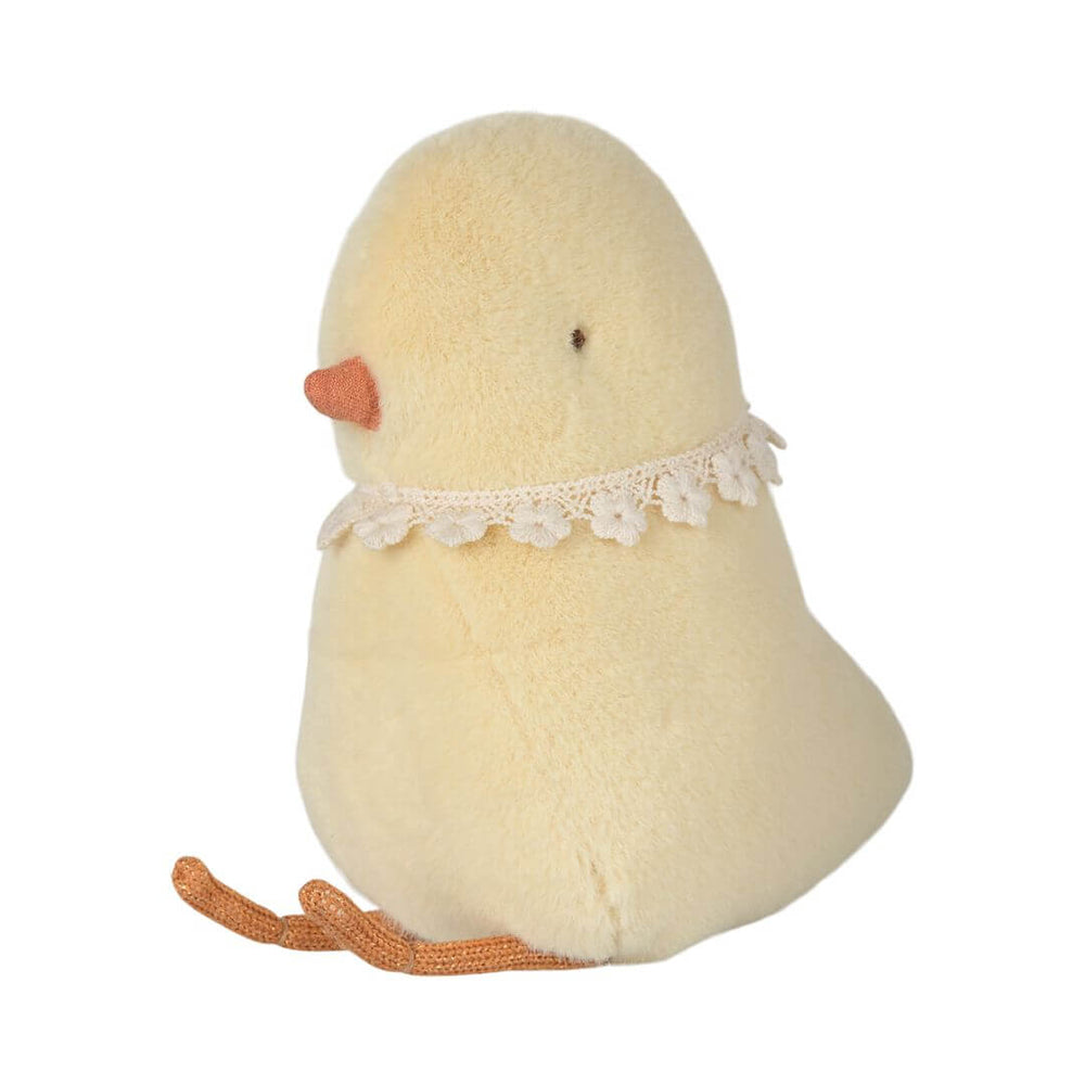 A yellow stuffed animal chick with a flower collar from Maileg.