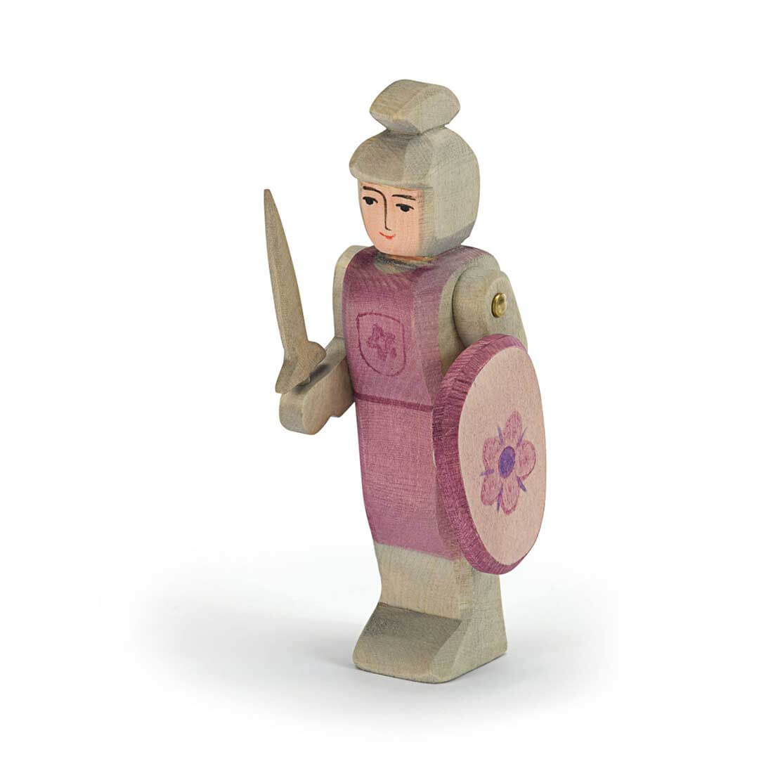 Ostheimer Wooden Figure Red Knight Standing with reddish purple vest and shorts, shield, sword, and helmet