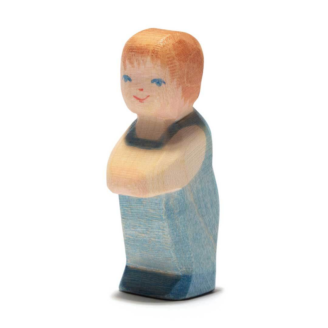 Ostheimer Wooden Figure Toddler with light brown hair and blue short sleeved shirt dress
