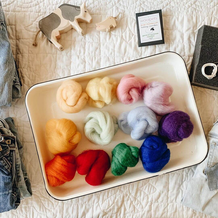 Wool roving colors on a tray.