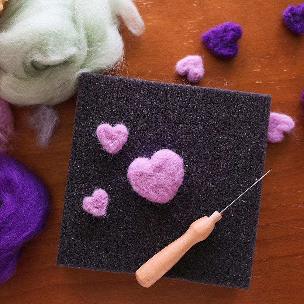 Woolpets Needle Felting Foam Pad with a heart.